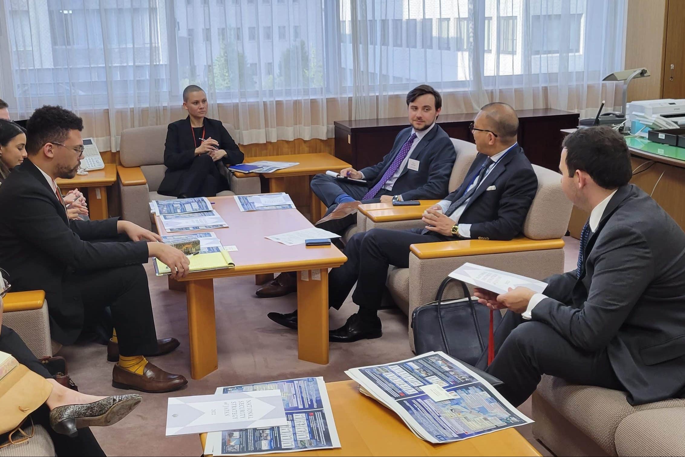 Staff meet with Assist. Chief Cabinet Sec. Keiichi Ichikawa.