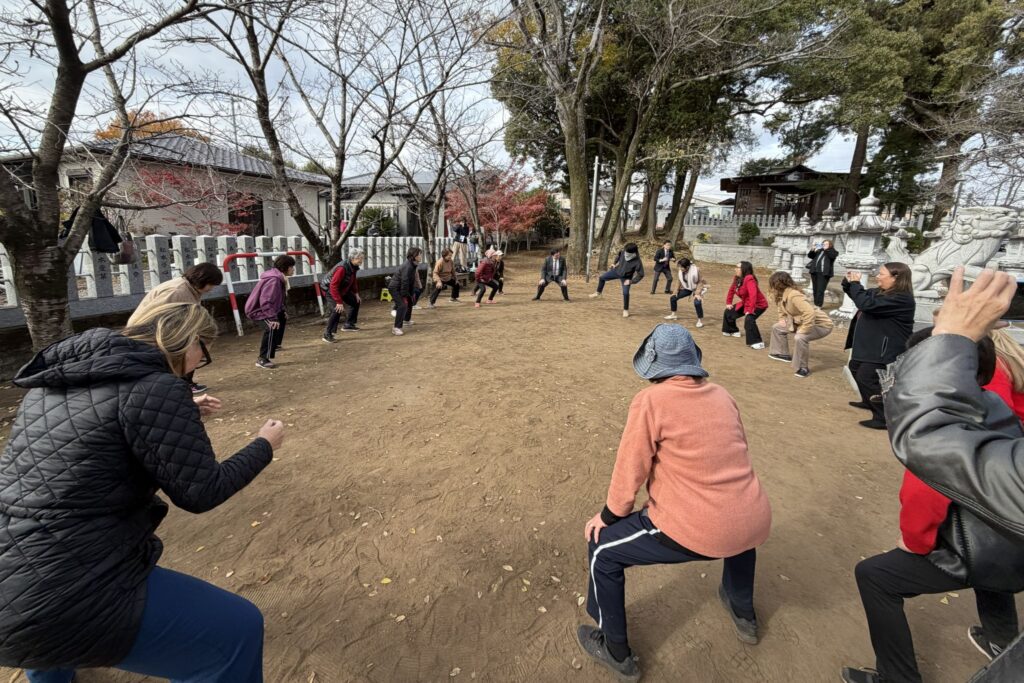 Joining residents for "Sumo stomp" exercise activities, hosted at a local shrine