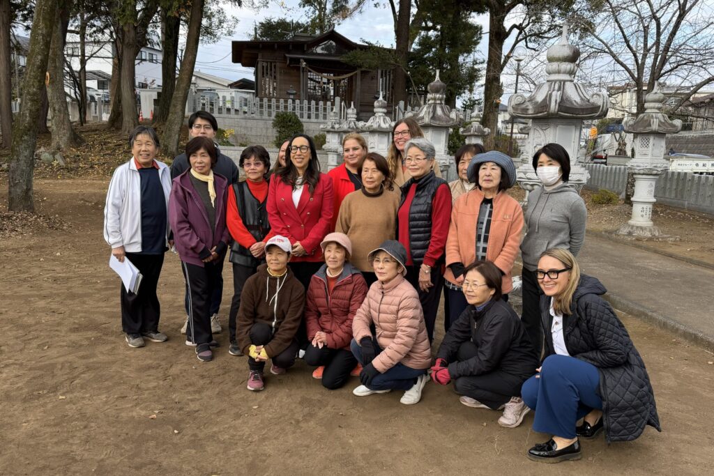 Posing with members of a "beauty walking" community exercise group