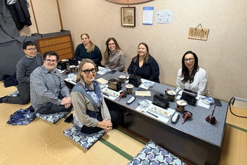 The group share reflections on the program at a midweek dinner