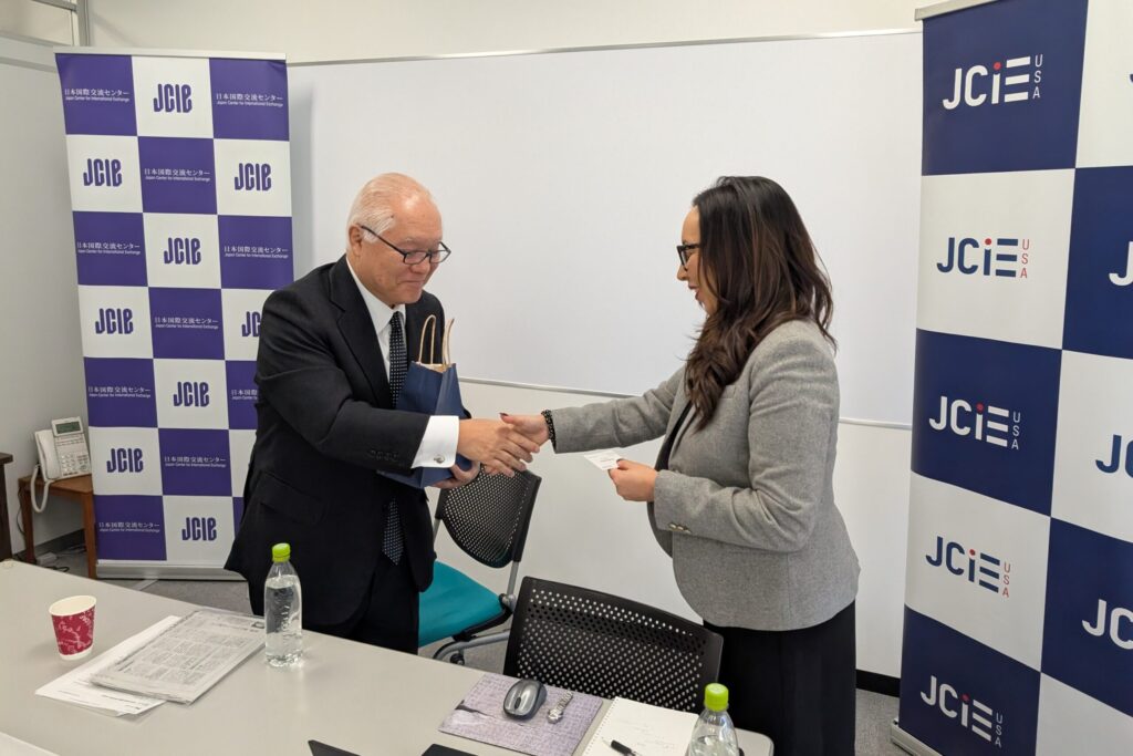 Supervisor Paloma Aguirre greets former Japanese Health Minister Keizo Takemi