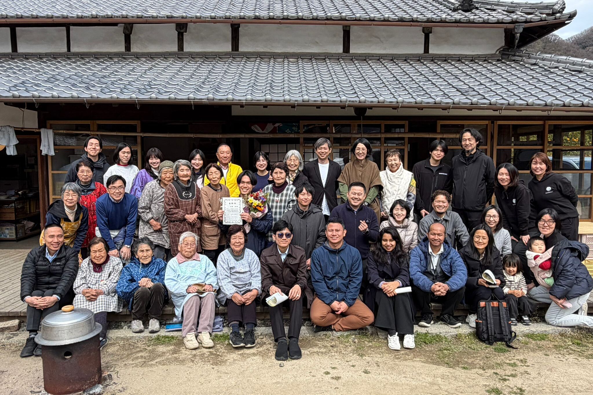 Group photo with island residents at community lunch