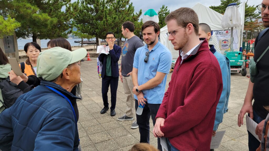 Steven chatting with a local volunteer guide who was showing the group around Miyajima, Hiroshima