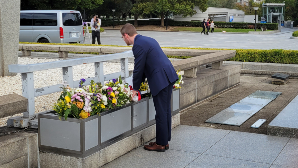 Steven presenting flowers at the Hiroshima Peace Memorial