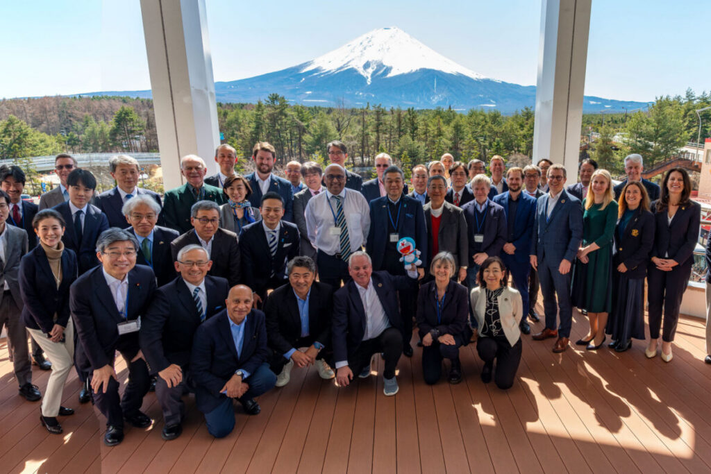 Group photo of participants in front of Mt. Fuji